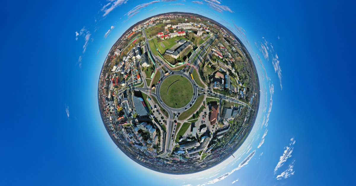 Birdseye view of a "full circle" community, pictured as a globe.