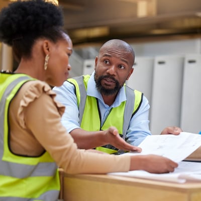 municipal employee discussing blueprints