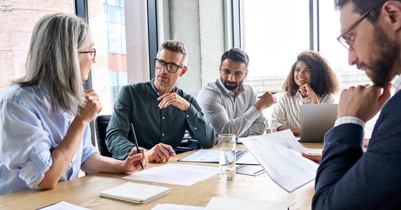 Permitting team sitting around table