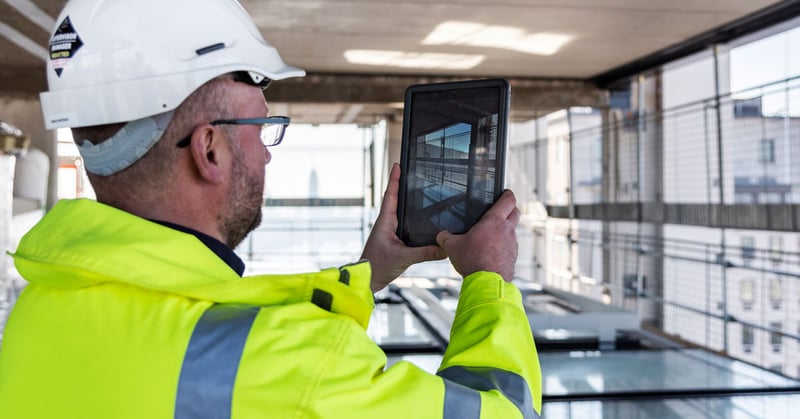 Man with tablet on job site