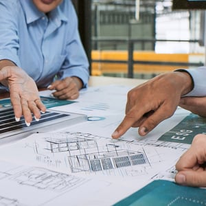 Group looking over building plans