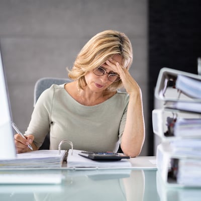 Woman at desk with paperwork