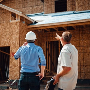 Men looking at completed construction project