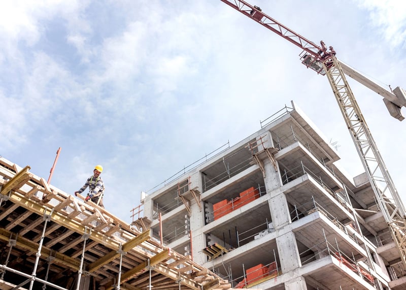 Man on top of building construction