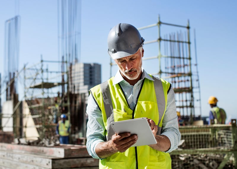 Man using tablet at construction site