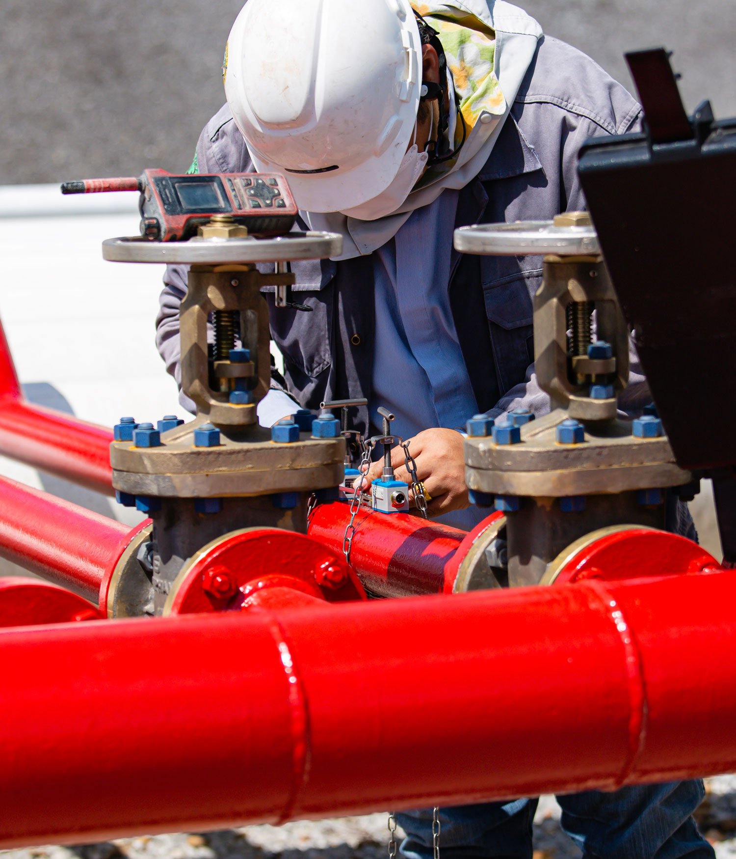 Worker testing fire hydrant pipes Worker testing fire hydrant pipes