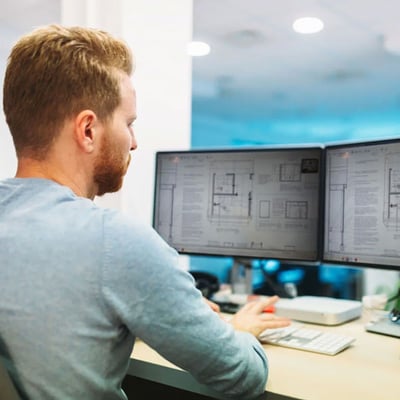 Guy reviewing blueprints