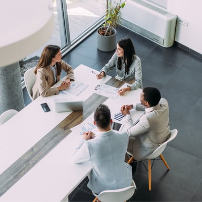 Team discussing documents at office