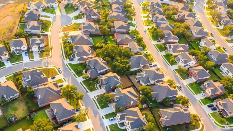 an aerial view of streets of houses in a subdivision