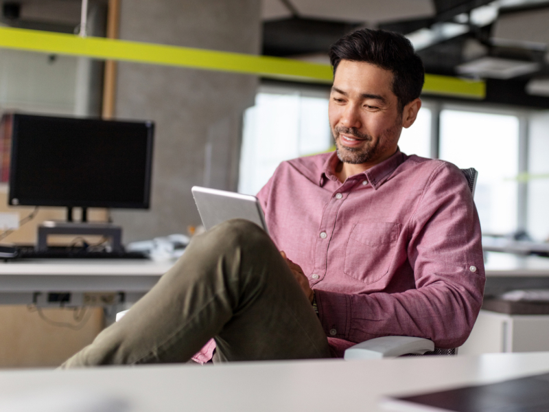 man-relaxed-while-working-on-easy-tasks