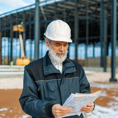 Senior advisor reviews a work plan. 