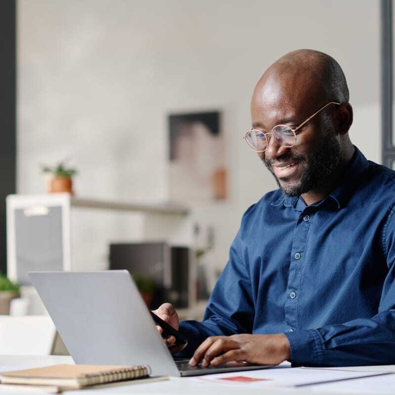 Man using laptop at desk