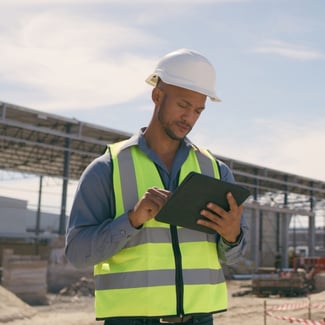 person-on-tablet-at-jobsite