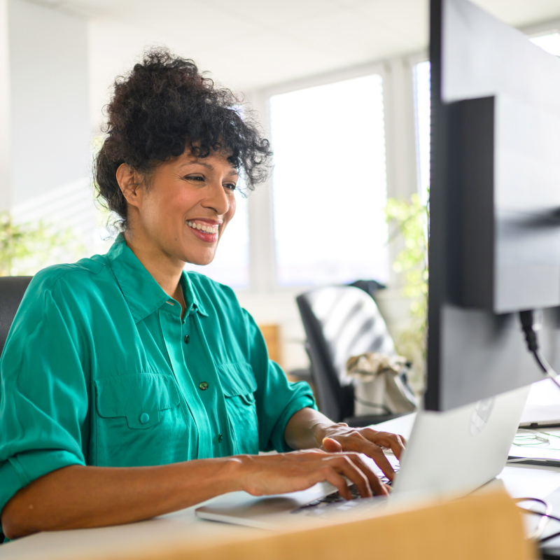 Woman reviewing permits on laptop