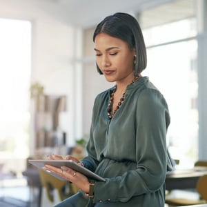 woman reviewing permits on tablet